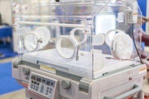 Empty infant incubator in an hospital room. Nursery incubator in hospital.