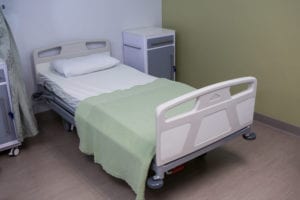 Close-up of empty bed in ward at hospital